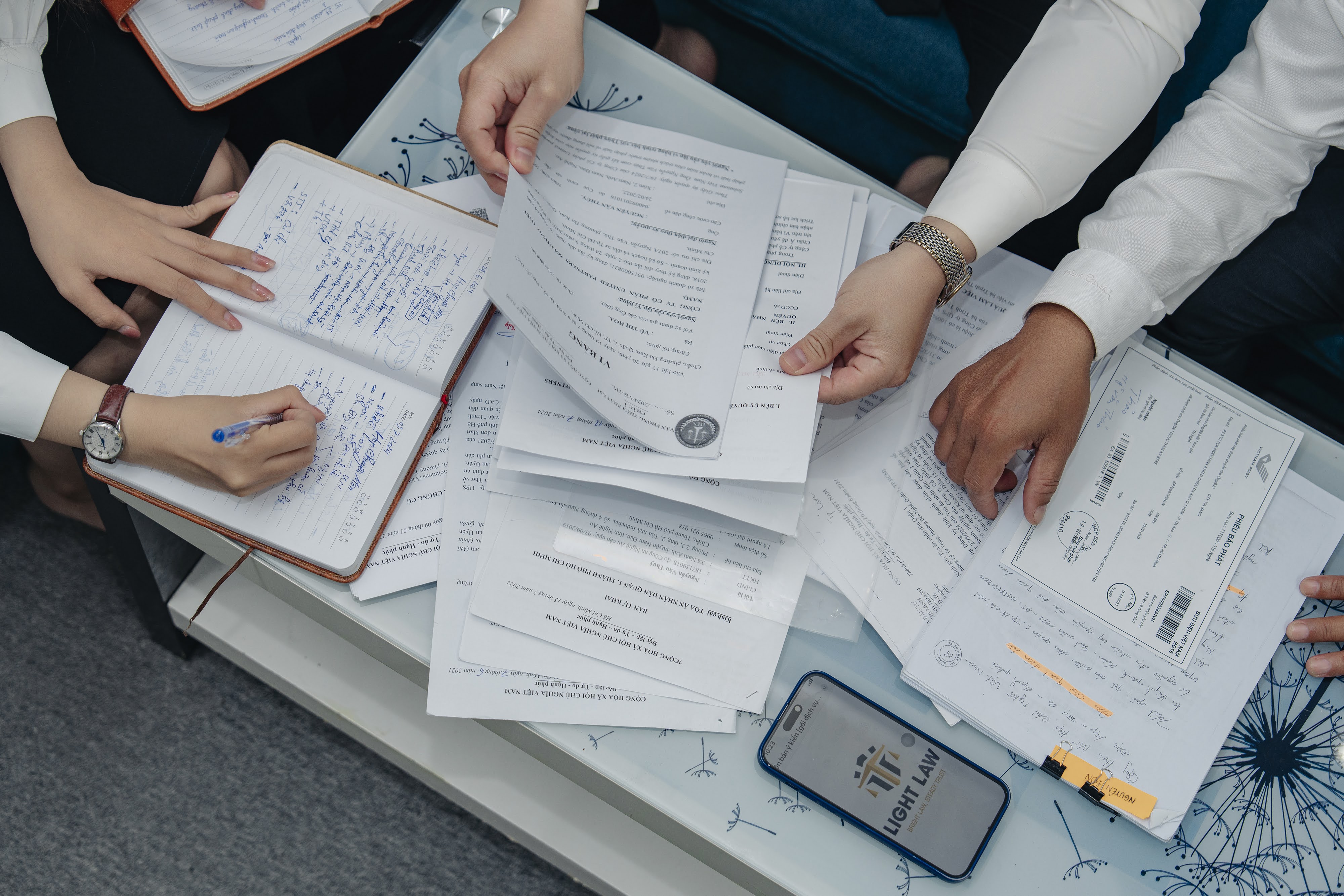 A judge's gavel and a person signing a documentAI-generated content may be incorrect.